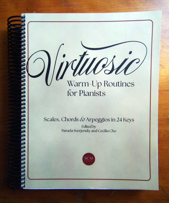 a spiral-bound piano excercize book